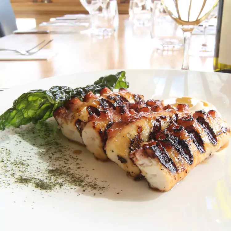 Grilled octopus on a share plate for a wedding meal